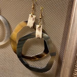 Water Buffalo horn earrings topped with leather